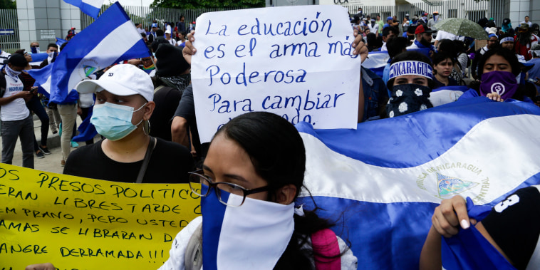 Demonstrators protest outside the Jesuit run Universidad Centroamericana, UCA, demanding the university's allocation of its share of 6% of the national budget, in Managua, Nicaragua, on Aug. 2, 2018.