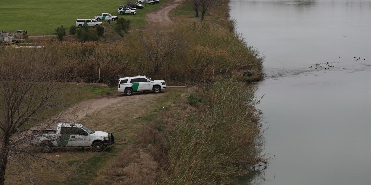 Law enforcement and Border Patrol vehicles line the banks of the Rio Grande along the U.S. border with Mexico in Piedras Negras, Texas, in 2019.