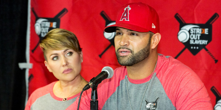 Deidre Pujols and Albert Pujols attend the Strike Out Slavery Press Conference at Angel Stadium on August 9, 2018 in Anaheim, Calif.