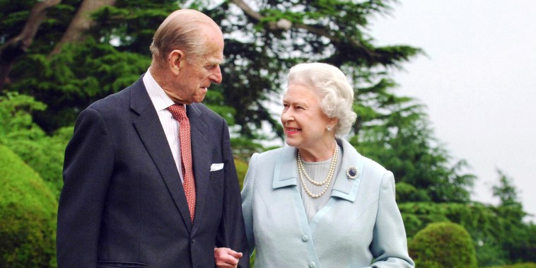 Britain's Queen Elizabeth II and her husband, the Duke of Edinburgh walk at Broadlands, Hampshire, earlier in the year.