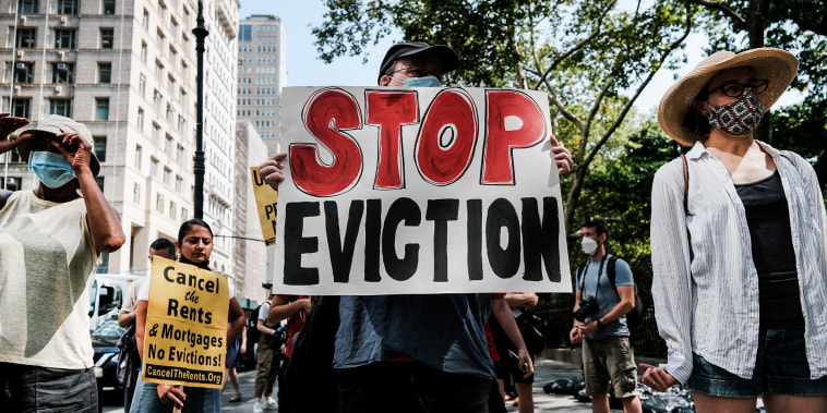 Activists hold a protest against evictions near City Hall on Aug. 11, 2021, in New York.