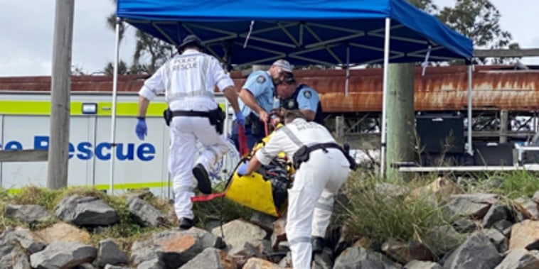Police rescue workers recover cocaine found near the body of a diver along the Hunter River in Newcastle, Australia on May 9, 2022.