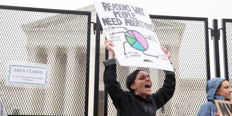 An abortion-rights protester shouts during a demonstration