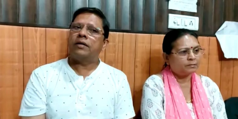 Sanjeev Ranjan Prasad and Sadhana Prasad wait at a lawyer's chamber in Haridwar, India on May 12, 2022.