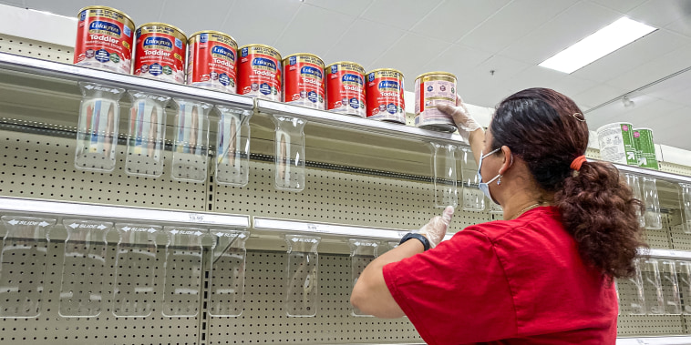 A worker restocks shelves with baby formula at a store in Pinole, Calif., on May 17, 2022