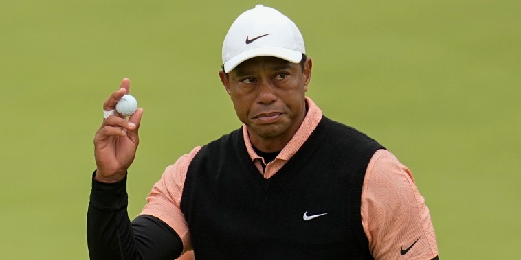 Tiger Woods waves after making a putt on the 18th hole during the third round of the PGA Championship golf tournament at Southern Hills Country Club on Saturday, May 21, 2022, in Tulsa, Oklahoma.