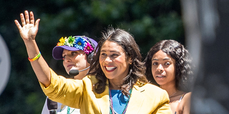San Francisco Mayor London Breed waves to a cheering crowd atop a float during the San Francisco Pride parade on June, 24, 2018.