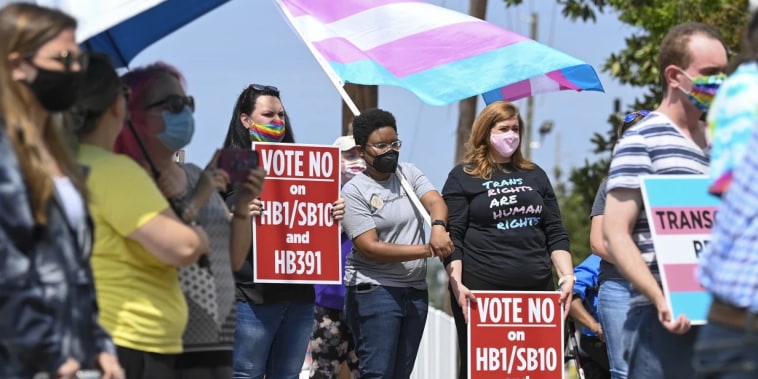 Opponents of several bills targeting transgender youth attend a rally at the Alabama State House on March 30 in Montgomery.