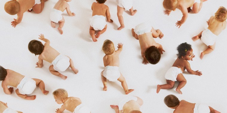 Diversity of babies crawling around in diapers