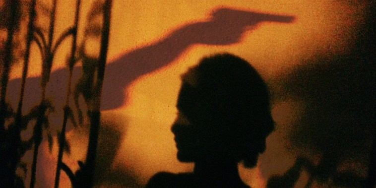 Shadow On Woman On Wall