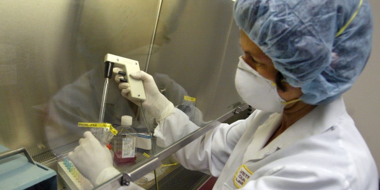 Assistant Scientist Sigrun Haugerud demonstrates how to prepare a test sample, the first step taken when testing for the monkeypox virus, at the University of Minnesota's Veterinary Diagnostic Laboratory.