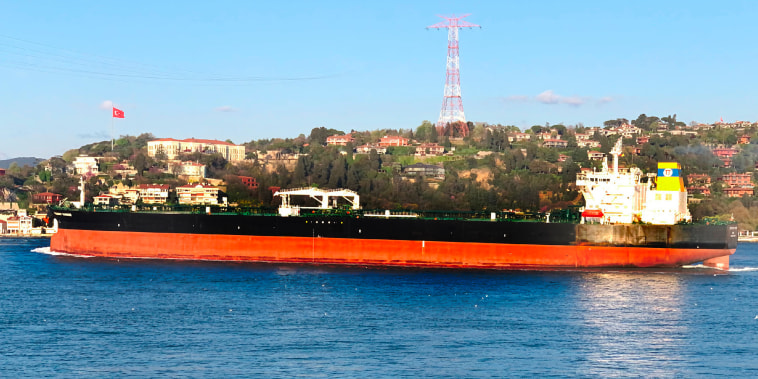 The Greek-flagged oil tanker Prudent Warrior, background, sails past Istanbul, Turkey, on April 19, 2019.