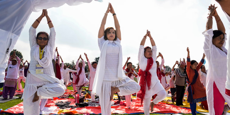 Image: People practice yoga to mark International Day of Yoga in Kathmandu, Nepal, on June 21, 2022.