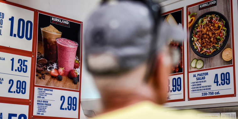 A customer views a menu displayed at the food court of a Costco Wholesale Corp. store in San Antonio, Texas, U.S., on Wednesday, May 30, 2018. Costco Wholesale Corp. is releasing earnings figures on May 31.