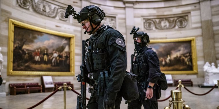 Members of the U.S. Secret Service Counter Assault Team walk through the Rotunda as they and other federal police forces responded as violent protesters loyal to President Donald Trump stormed the U.S. Capitol on Jan. 6, 2021.