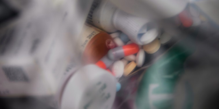 A plastic bag of assorted pills and prescription drugs dropped off for disposal sits in a container during the Drug Enforcement Administration (DEA) 20th National Prescription Drug Take Back Day at Watts Healthcare, on April 24, 2021, in Los Angeles.