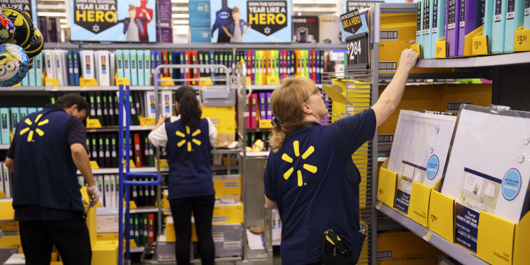 Image: Employees restock shelves of school supplies at a Wal-Mart Stores Inc. location in Burbank, Calif., on Aug. 8, 2017.