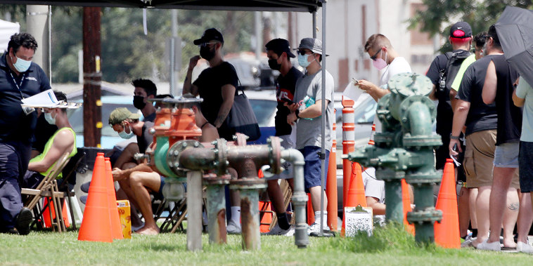 Image: People line up get vaccinated against the monkeypox virus on July 21, 2022, at Ted Watkins Park in Los Angeles.