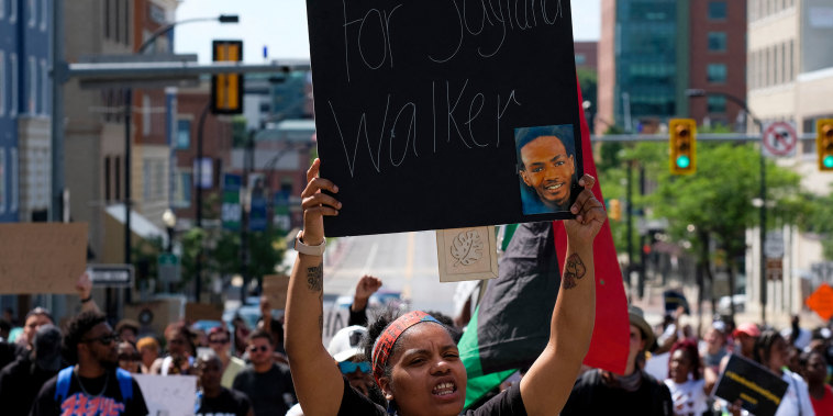 Demonstrators gather outside Akron City Hall to protest the killing of Jayland Walker, shot by police, in Akron, Ohio, July 3, 2022. - Several hundred protesters marched Sunday in Akron, Ohio after the release of body camera footage that showed police fatally shooting a Black man with several dozen rounds of bullets.
As anger rose over the latest police killing of a Black man in the United States, and authorities appealed for calm, a crowd marched to City Hall carrying banners with slogans such as "Justice for Jayland." (Photo by Matthew Hatcher / AFP) (Photo by MATTHEW HATCHER/AFP via Getty Images)