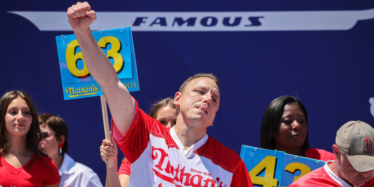 NEW YORK, USA - JULY 04: Joey Chestnut won first place eating 63 hot dogs in 10 minutes during the men 2022 Nathan's Famous International Hot Dog Eating Contest at Maimonides Park of Coney Island in the Brooklyn borough of New York City, United States on July 4, 2022. (Photo by Tayfun Coskun/Anadolu Agency via Getty Images)