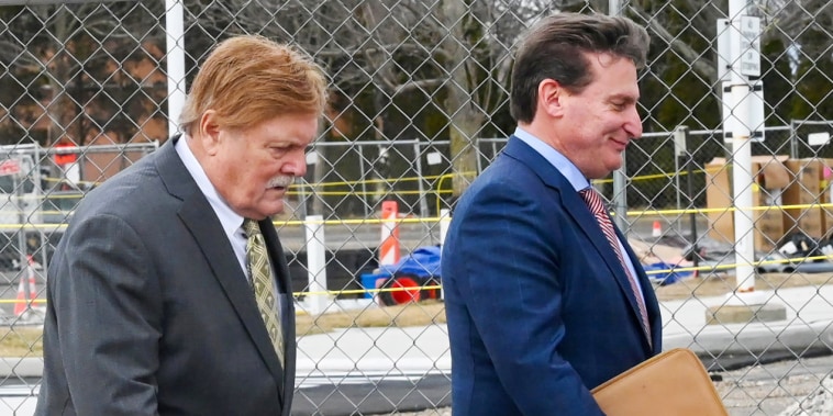 Image: Robert Fehring, left, arrives at federal court with his attorney in Central Islip, N.Y., on Feb. 23, 2022.