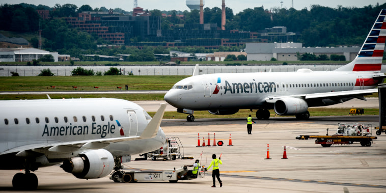 Airplanes sit on the tarmac at Ronald Reagan Washington National Airport in Arlington, Va., on July 2, 2022.