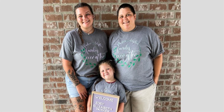 Emily and Jennifer Parker, right, with their daughter Zoey on Aug. 3, 2022, the day they adopted her.