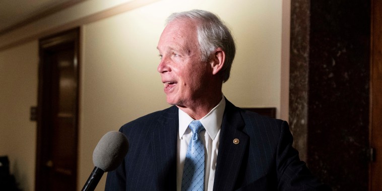 Sen. Ron Johnson speaks to a reporter outside of the Senate Homeland Security hearing room on Aug. 3, 2022.