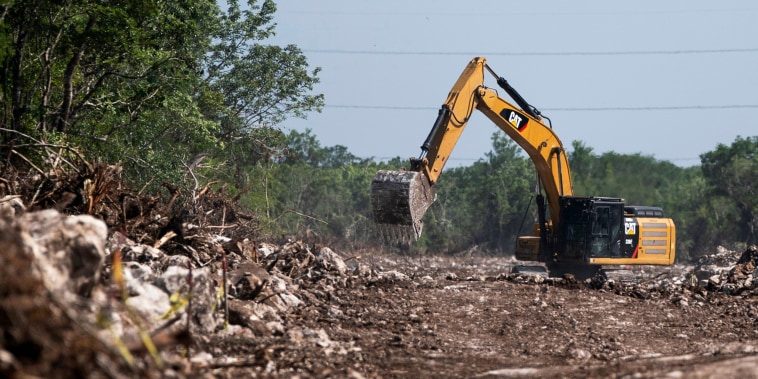 A bulldozer works to make way for the Maya Train in Puerto Morelos, Quintana Roo state, Mexico on Aug. 2, 2022.