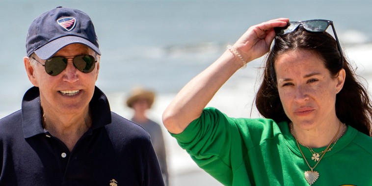 Image: President Joe Biden walks on the beach with daughter Ashley Biden, in Rehoboth Beach, Del., June 20, 2022.