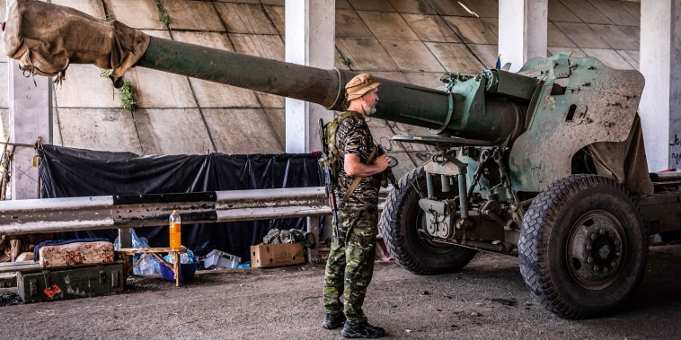 A Ukrainian soldier from the artillery battalion waits for further orders to use a 152mm artillery to fire at the Russian troops close to the frontline at an undisclosed position in Mykolaiv Oblast, Ukraine on Aug. 19, 2022.