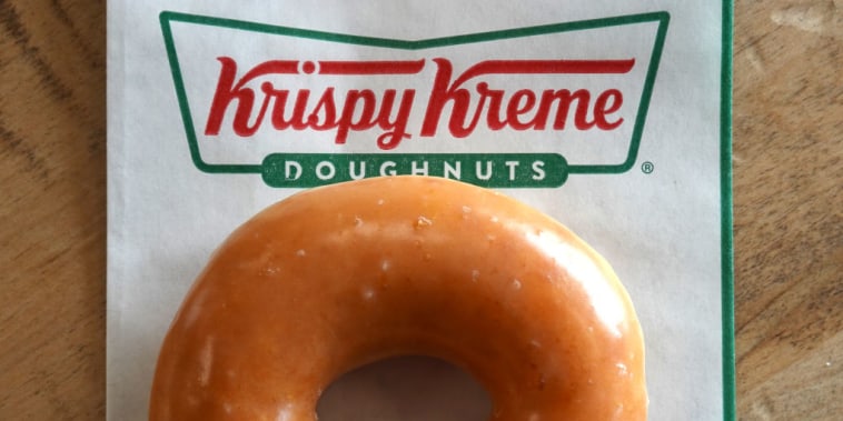 DALY CITY, CALIFORNIA - MAY 12: In this photo illustration, a Krispy Kreme glazed doughnut is shown on May 12, 2022 in Daly City, California. Krispy Kreme reported strong first quarter earnings with net income of $4 million compared with a loss of $3.06 million one year ago. (Photo Illustration by Justin Sullivan/Getty Images)