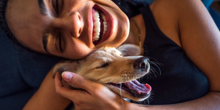 woman and dog smiling