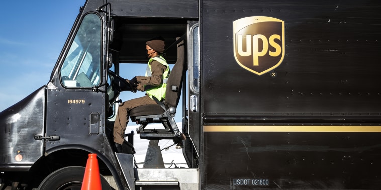 A United Parcel Service (UPS) driver leaves a UPS facility on March 15, 2021 in Landover, Md.