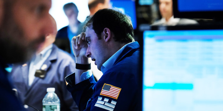 Traders work on the floor of the New York Stock Exchange
