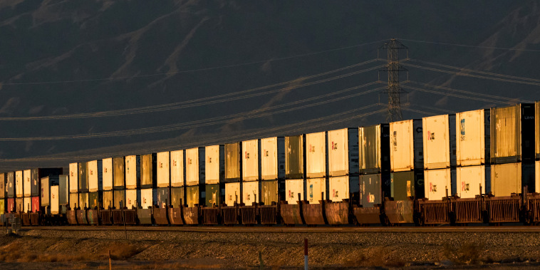 Cargo containers onboard a freight train in Niland, Calif., on Dec. 15, 2021.