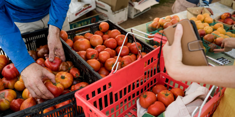 A customer shops at a farmers market in Las Vegas on July 20, 2022.