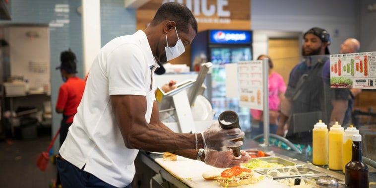 Keith Millner, co-owner of Jersey Mike's sandwich shop in Atlanta, works behind the counter on Sept. 17, 2022.