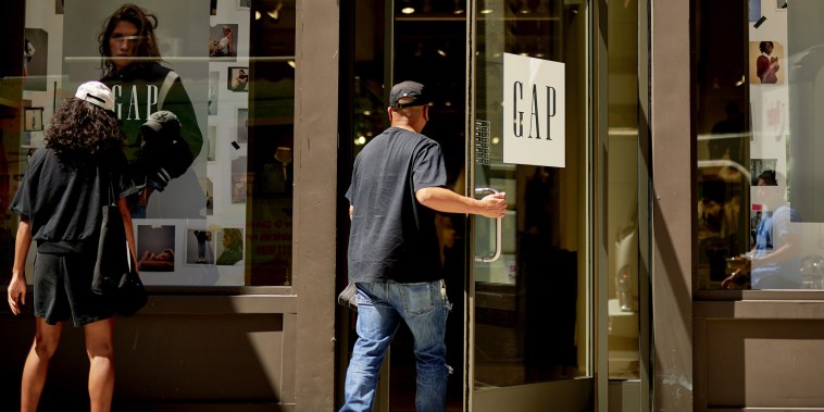 A customer enters a Gap retail store