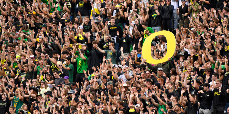 Oregon students and fans cheer the during the first half of an NCAA college football game against BYU, in Eugene, Ore., on Sept. 17, 2022.