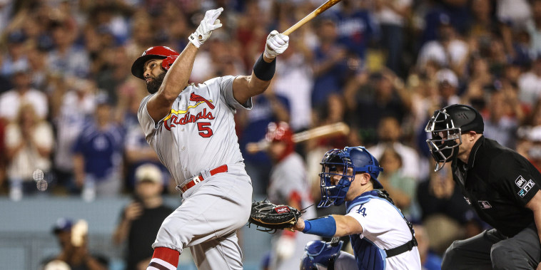 Image: Albert Pujols #5 of the St. Louis Cardinals hits career homerun 700 in front of Will Smith #16 of the Los Angeles Dodgers, a three run homerun to take a 5-0 lead, during the fourth inning at Dodger Stadium on Sept. 23, 2022 in Los Angeles.