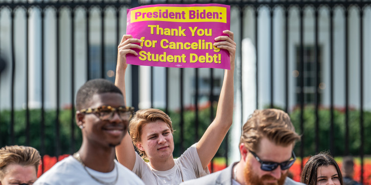 Student loan debt activists rally outside the White House a day after President Biden announced a plan that would cancel $10,000 in student loan debt for those making less than $125,000 a year in on Aug. 25, 2022.