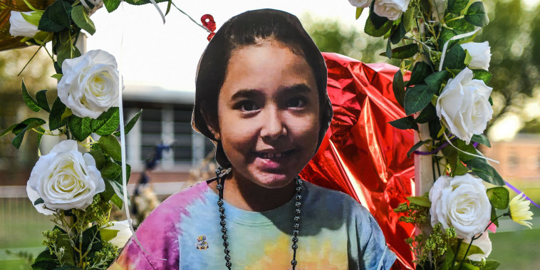 A photo of Alithia Ramirez, 10, who died in the mass shooting, is placed at a makeshift memorial at Robb Elementary School in Uvalde, Texas, on May 30, 2022.