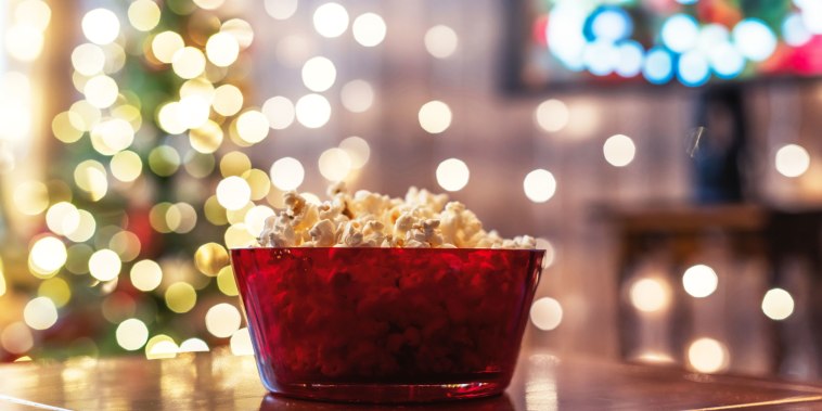 bowl of popcorn in front of christmas tree