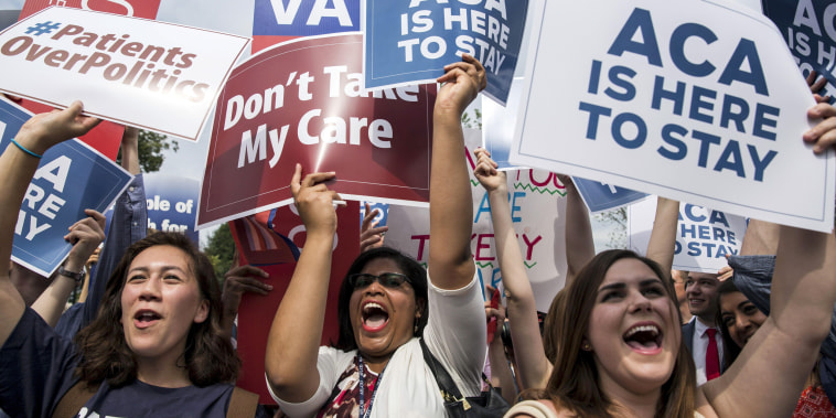 Supporters of the Affordable Care Act celebrate after the Supreme Court up held the law in the 6-3 vote at the Supreme Court in Washington June 25, 2015.