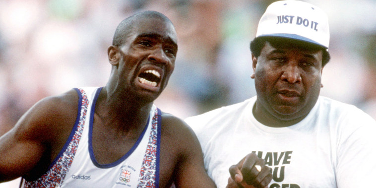 Great Britain's Derek Redmond is helped by his father, Jim, as he limps to the finish line at the Barcelona Olympic Games in 1992.