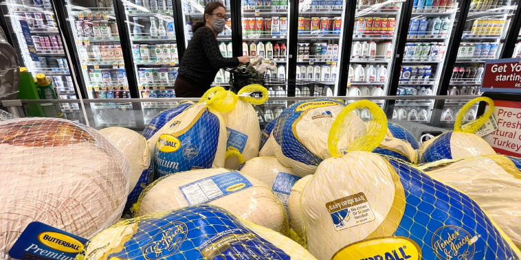 A shopper walks past turkeys for sale in a grocery store, on Nov. 11, 2021 in Los Angeles, Calif.