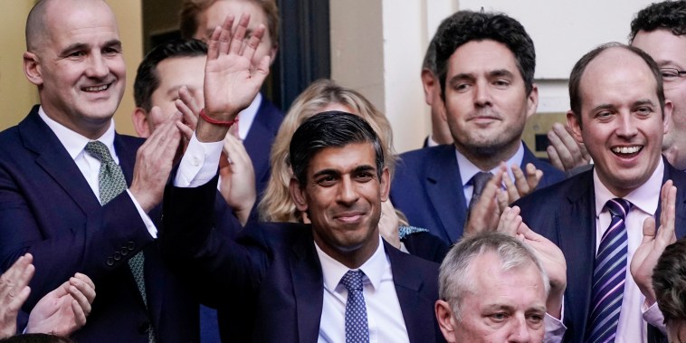 Rishi Sunak waves after winning the Conservative Party leadership contest at the Conservative party Headquarters in London on Oct. 24, 2022.