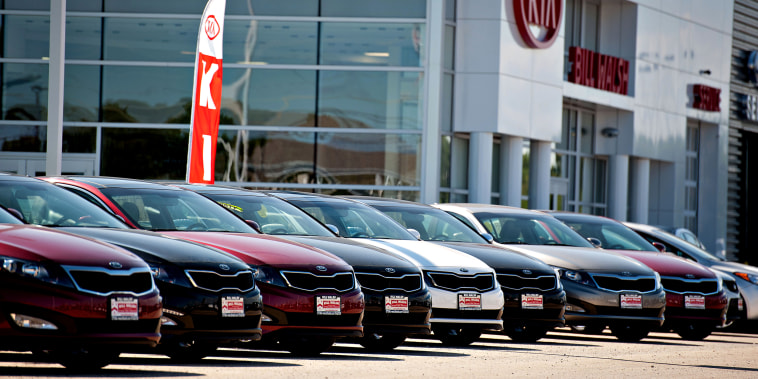 New Kia Motors Corp. vehicles sit outside of the Bill Walsh Kia car dealership in Ottawa, Illinois, U.S., on Tuesday, Sept. 3, 2013. Domestic and total vehicle sales figures are expected to be released on Sept. 4.