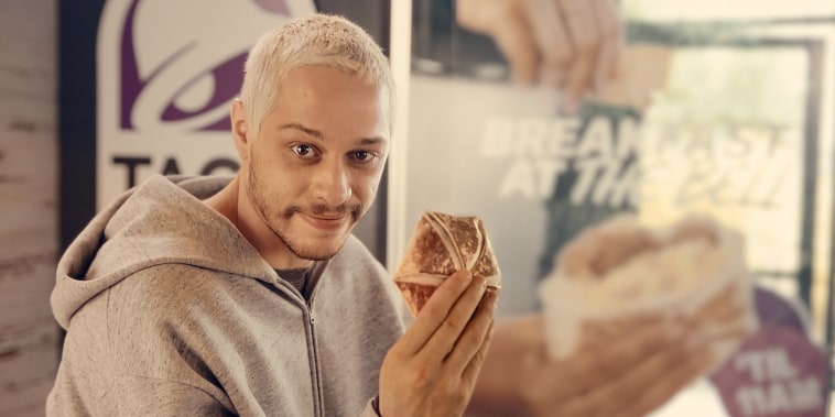 Pete Davidson with breakfast crunch wrap from Taco Bell